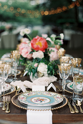 Wedding reception long head table place setting with gold rimmed goblets and floral garland at Marie Gabrielle in Dallas, Texas by After Yes
